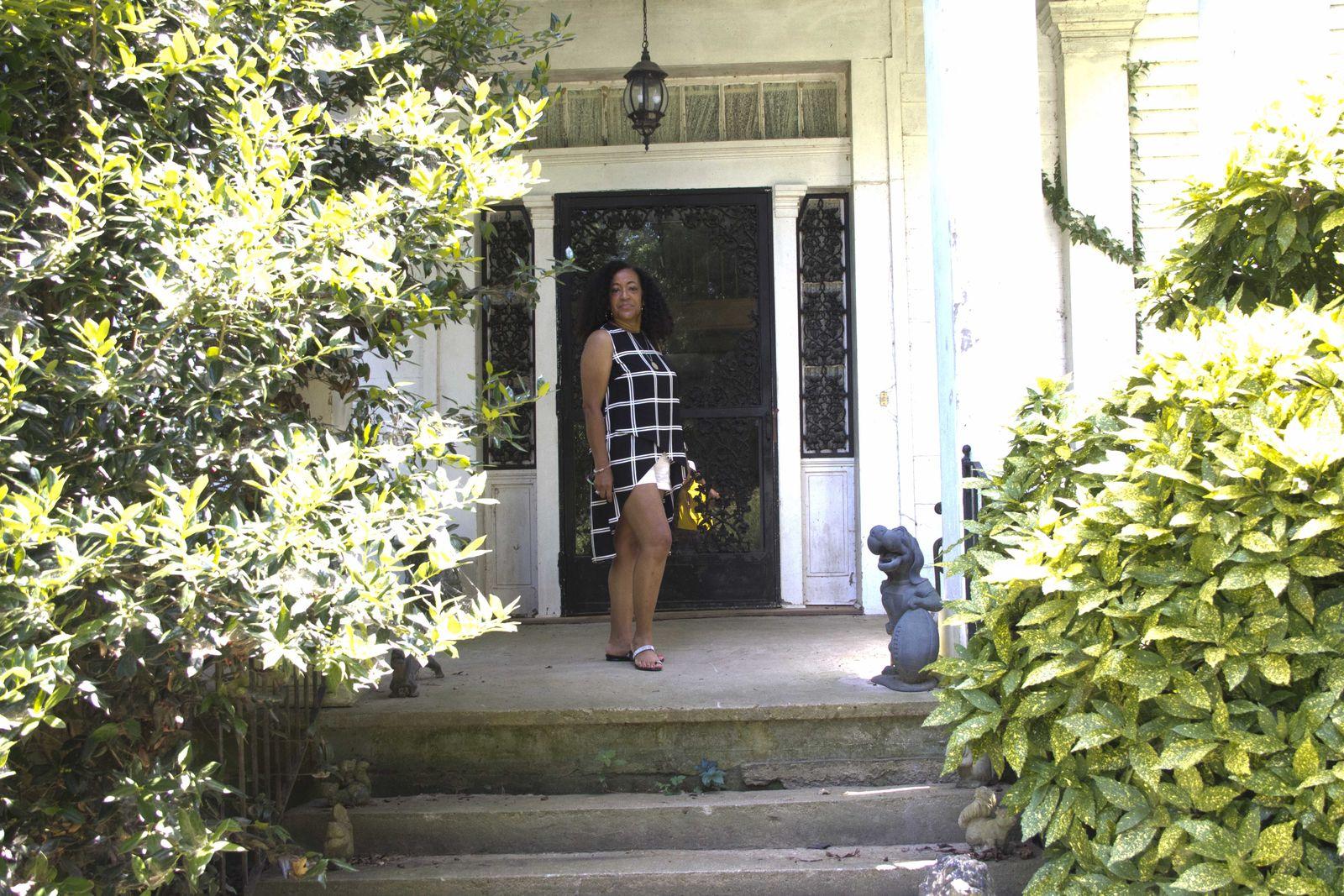 Dr. Carolyn Haliburton Carter standing at the front door of the Currie/Curry plantation house in Haywood County, Tennessee.